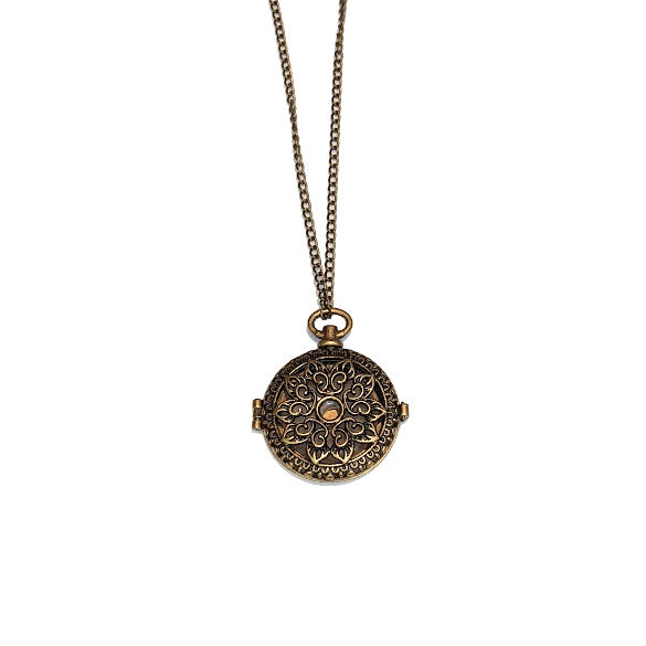 RAIN: BRONZE LOCKET WITH MILKY QUARTZ