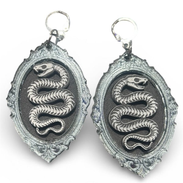 Taco: Serpent Skeleton Portrait Earrings