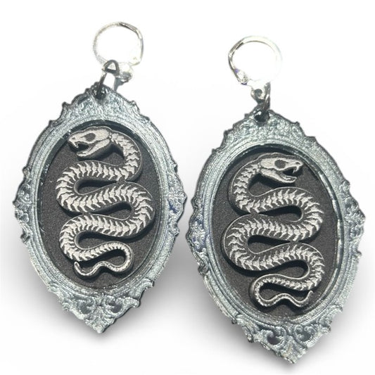 Taco: Serpent Skeleton Portrait Earrings